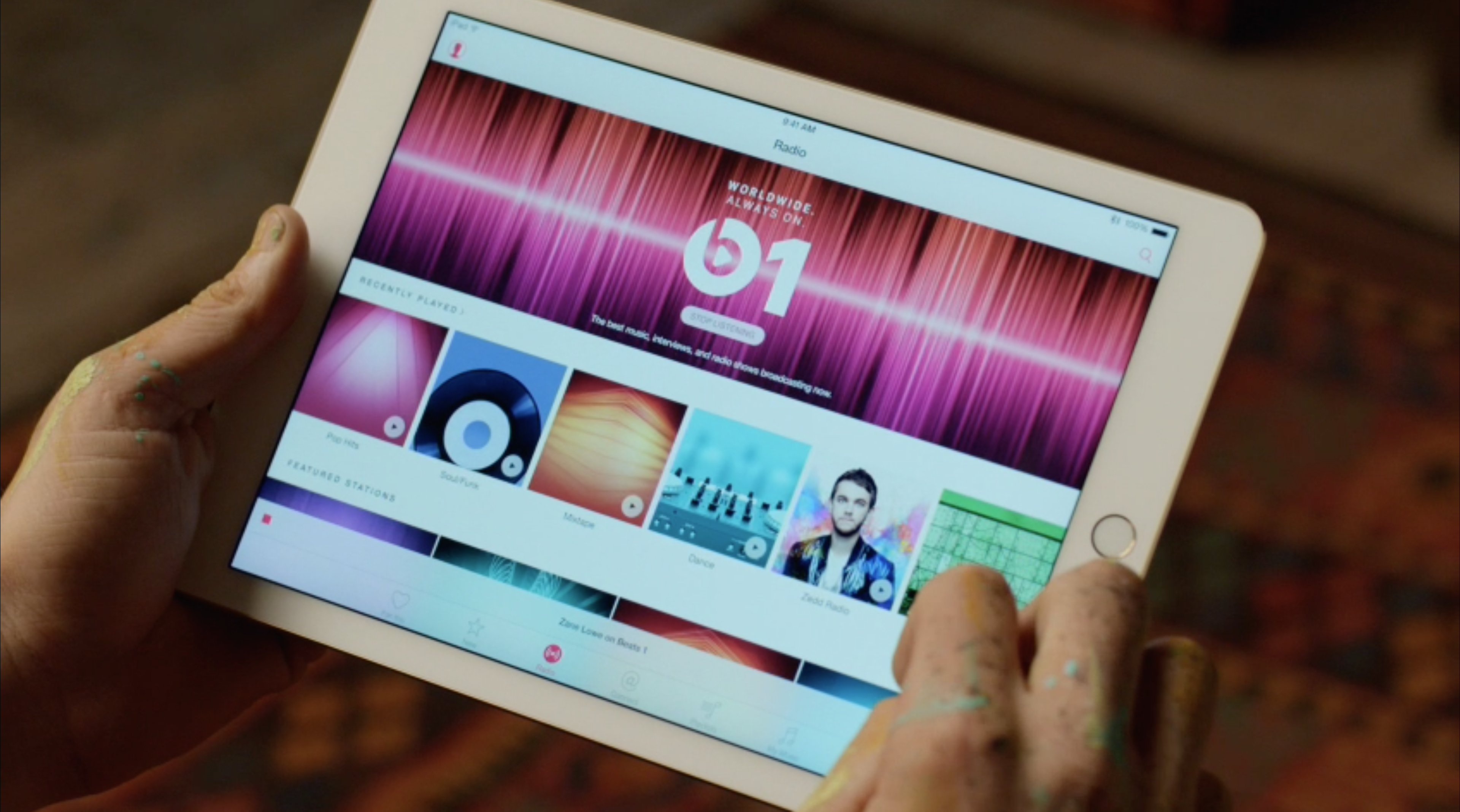 Apple Music's target persona permanently has paint-spattered hands.