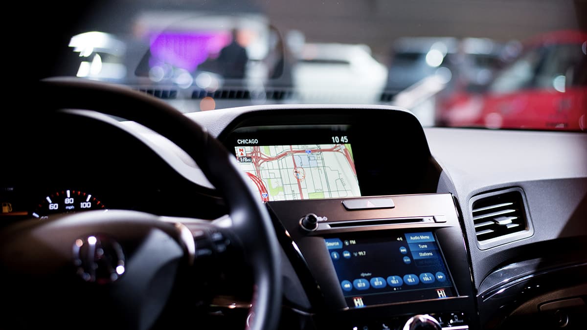 Split car console displaying navigation and radio options